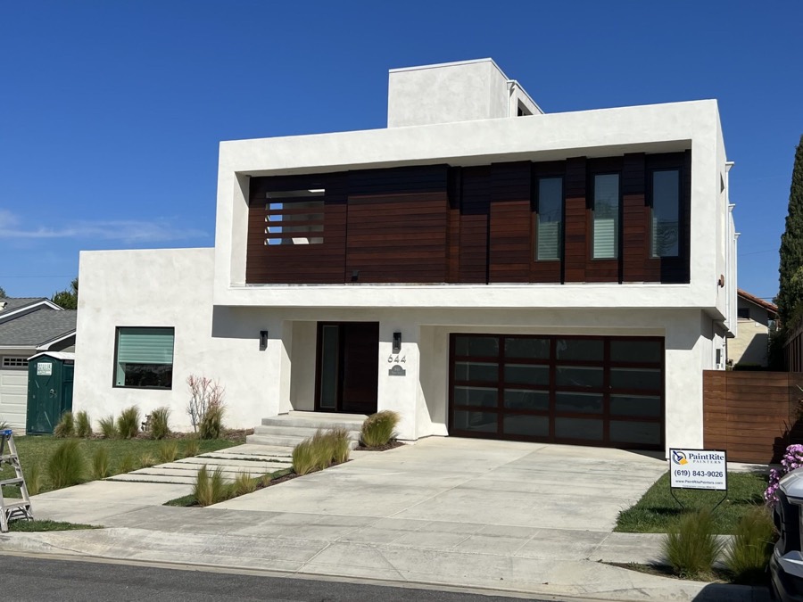 Modern two-story home with freshly painted white exterior