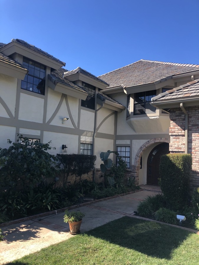Tudor-style home with repainted trim and stucco