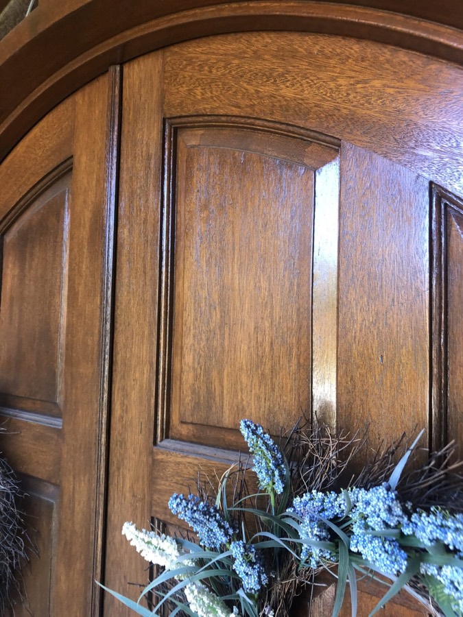 Close-up of a wood door being refinished